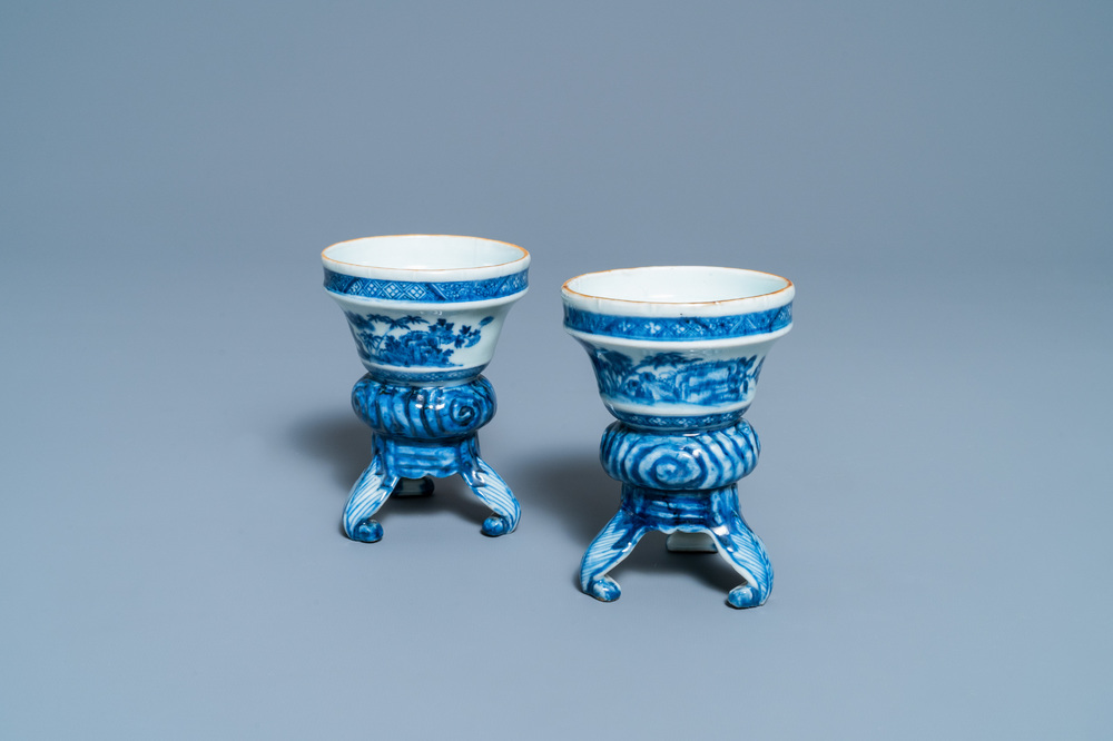 A pair of Chinese blue and white rococo-style tripod salts, Qianlong