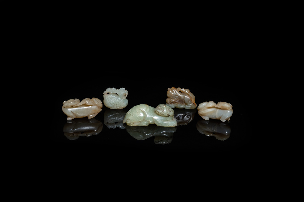 Five Chinese celadon and russet jade carvings, 19th C.