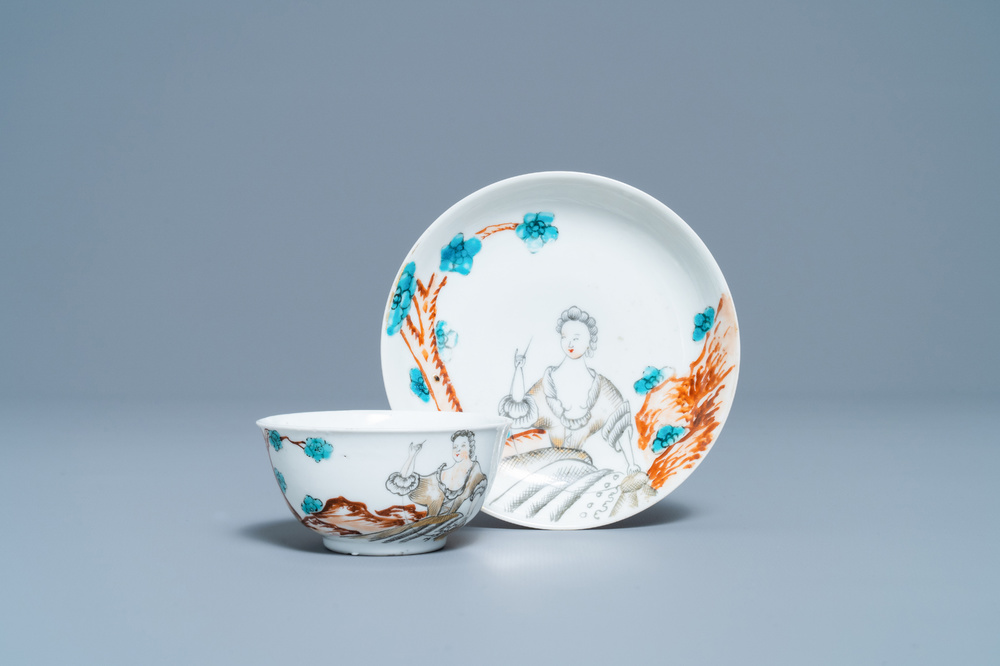 A Chinese export porcelain cup and saucer with a seamstress, Qianlong