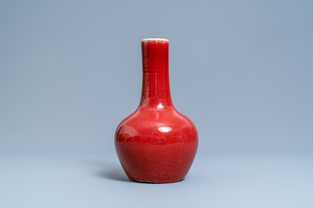 A Chinese monochrome sang de boeuf-glazed bottle vase, 19th C.