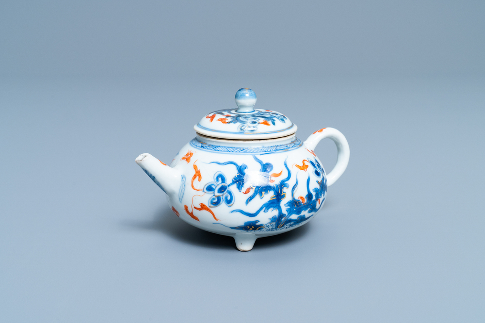A Chinese blue, white, iron red and gilt tripod teapot and cover, Kangxi