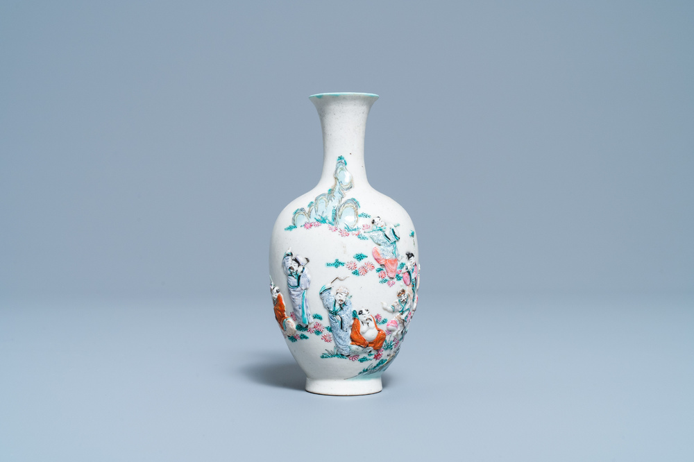 A Chinese famille rose relief-molded 'immortals' vase, Qianlong mark, 19th C.