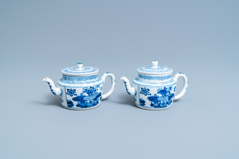A pair of Chinese blue and white 'antiquities' teapots, Kangxi