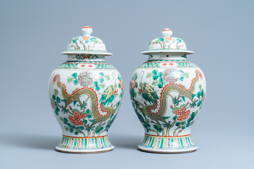 A pair of Chinese famille verte 'dragon' vases and covers, 19th C.