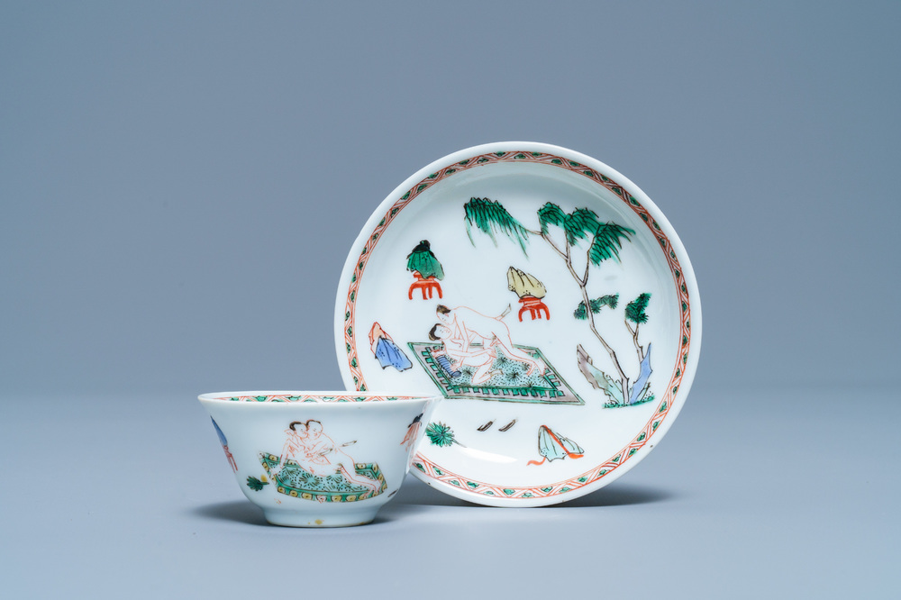 A Chinese famille verte 'erotical subject' cup and saucer, Kangxi