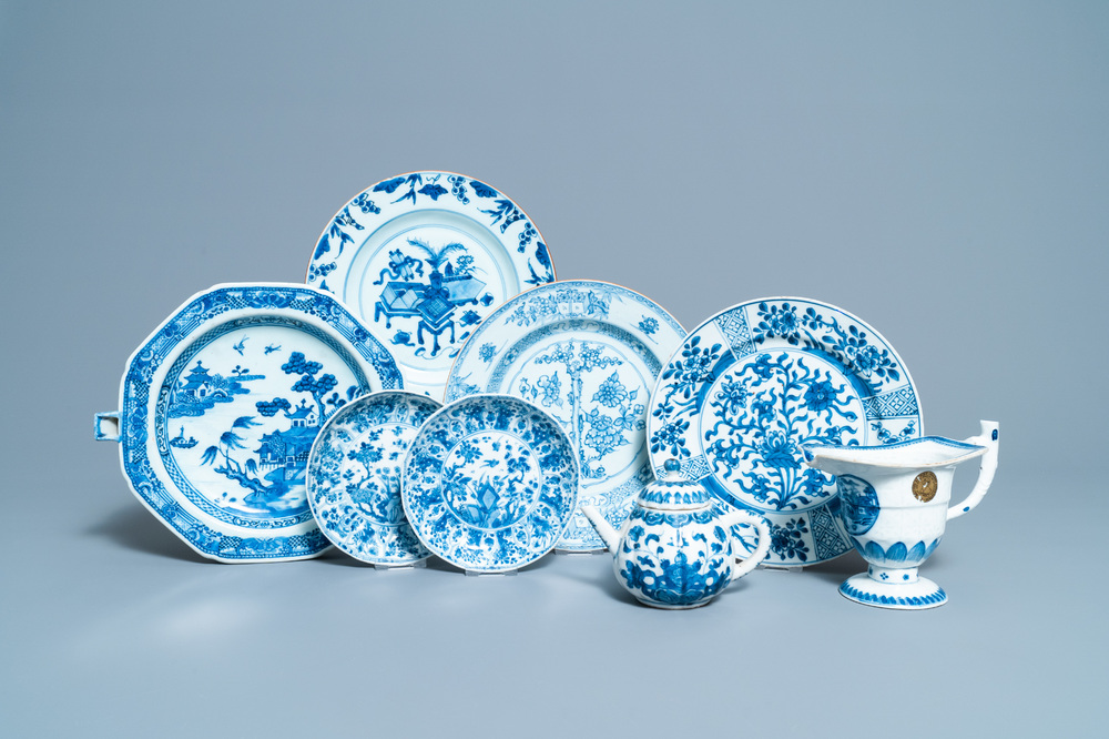 Six Chinese blue and white dishes, a teapot and a helmet-shaped jug, Kangxi and later