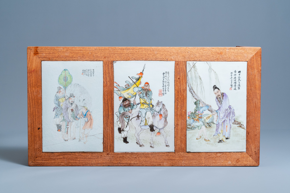 A Chinese wooden table with three qianjiang cai plaques, 19/20th C.