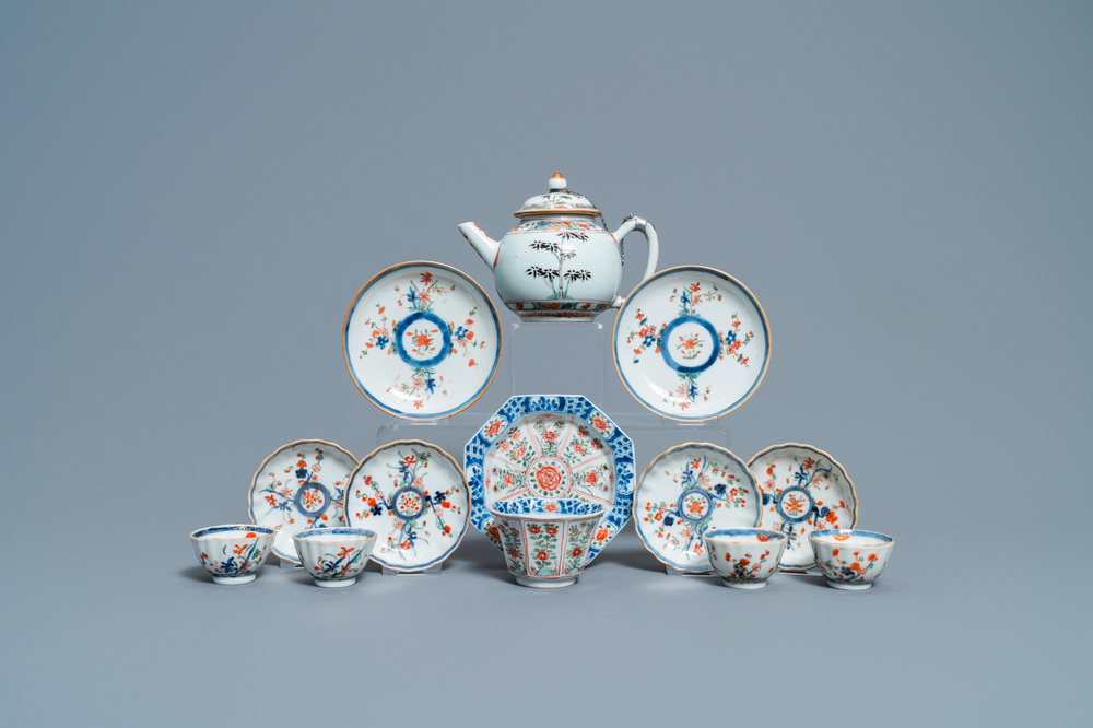 A Chinese famille verte teapot, seven saucers and five cups, Kangxi