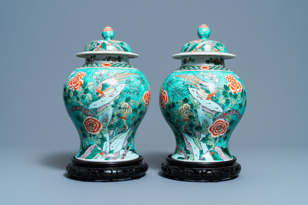 A pair of Chinese turquoise-ground famille verte vases and covers, 19th C.