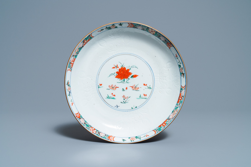 A Chinese famille verte 'mandarin ducks' dish with an incised lotus design, Kangxi