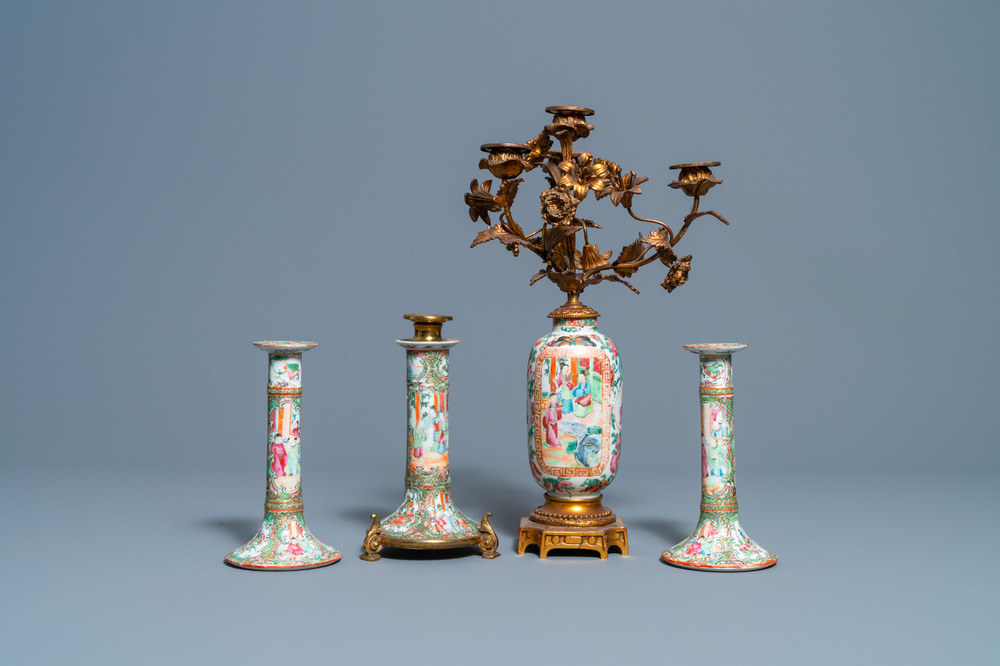 Three Chinese Canton famille rose candlesticks and a vase with gilt bronze mounts, 19th C.