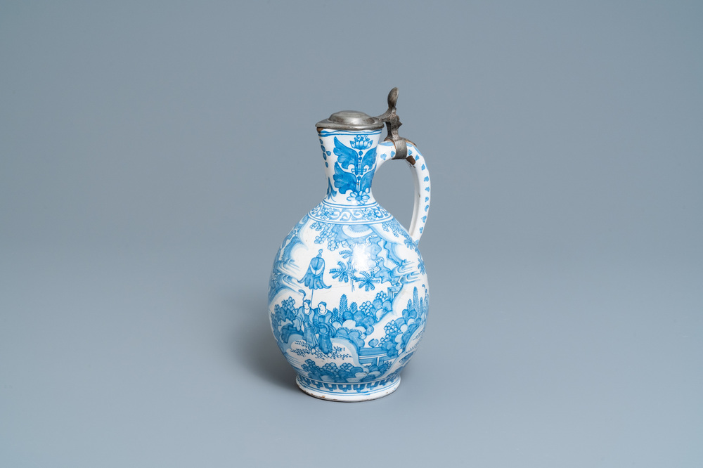 A large Dutch Delft blue and white chinoiserie jug with pewter cover, 17th C.