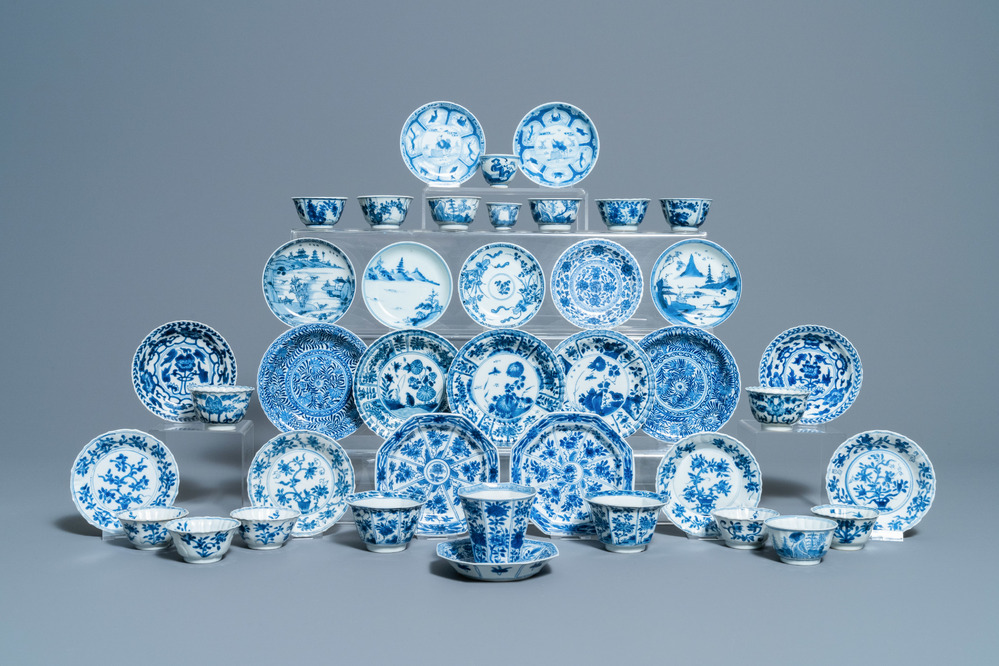 Nineteen Chinese blue and white cups and twenty-one saucers, Kangxi and later