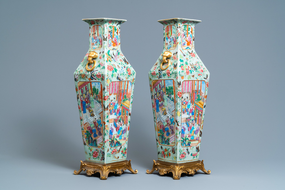 A pair of Chinese square famille rose celadon-ground vases on gilt bronze feet, 19th C.