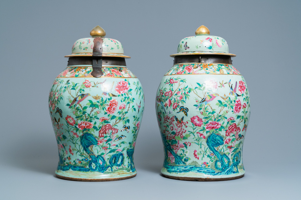 A pair of large Chinese Canton famille rose celadon-ground vases and covers, 19th C.