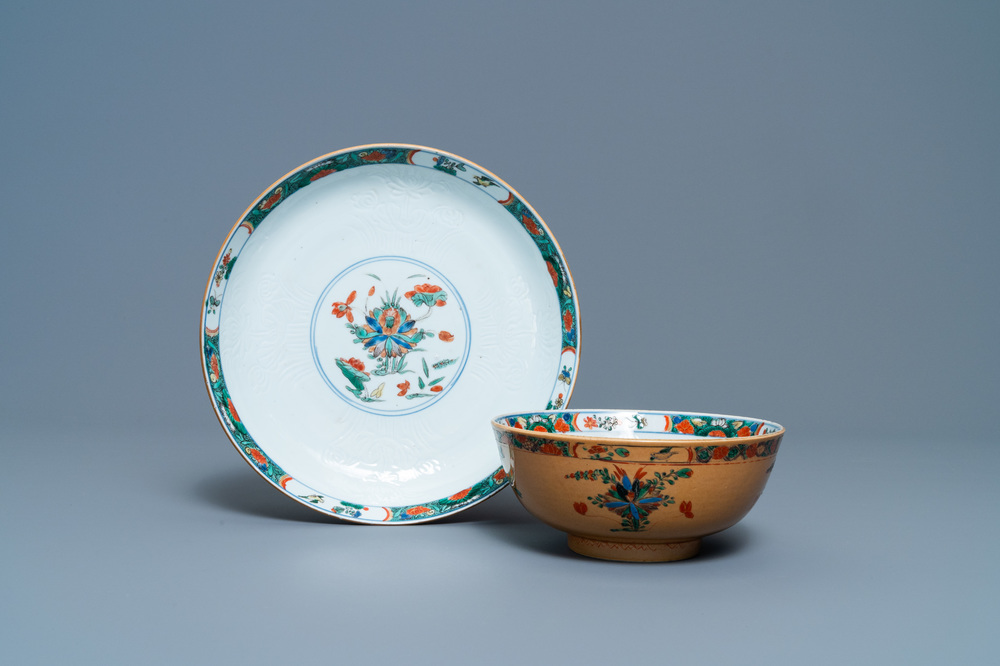 A Chinese capucine brown-ground famille verte plate and a bowl, Kangxi