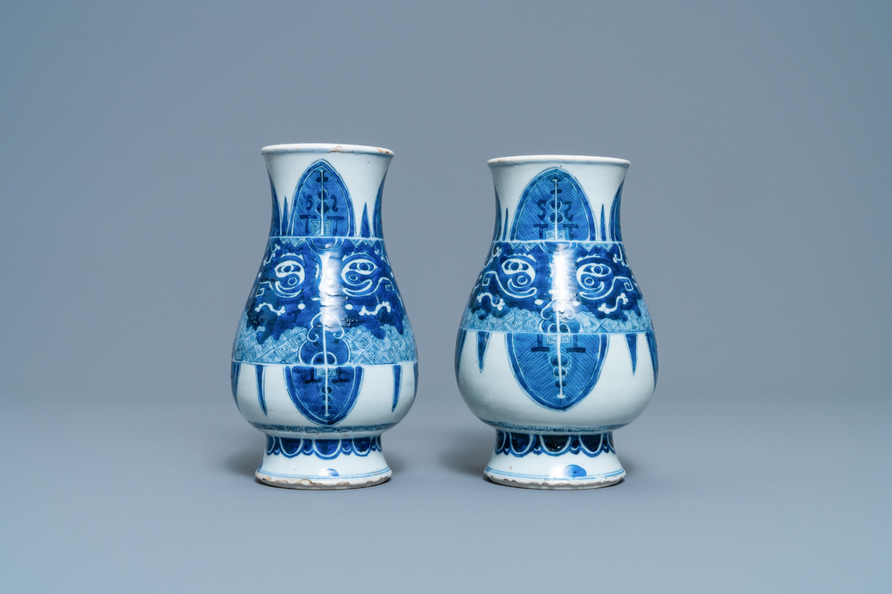 A pair of Chinese blue and white 'taotie' vases, Kangxi
