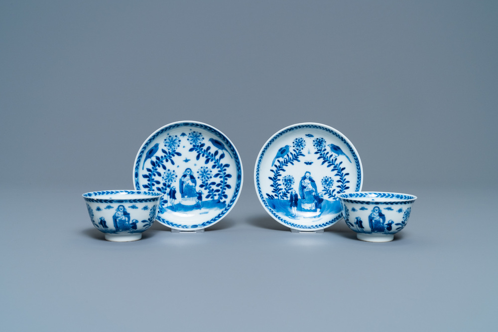 A pair of Chinese blue and white 'Caritas' cups and saucers, Kangxi/Yongzheng