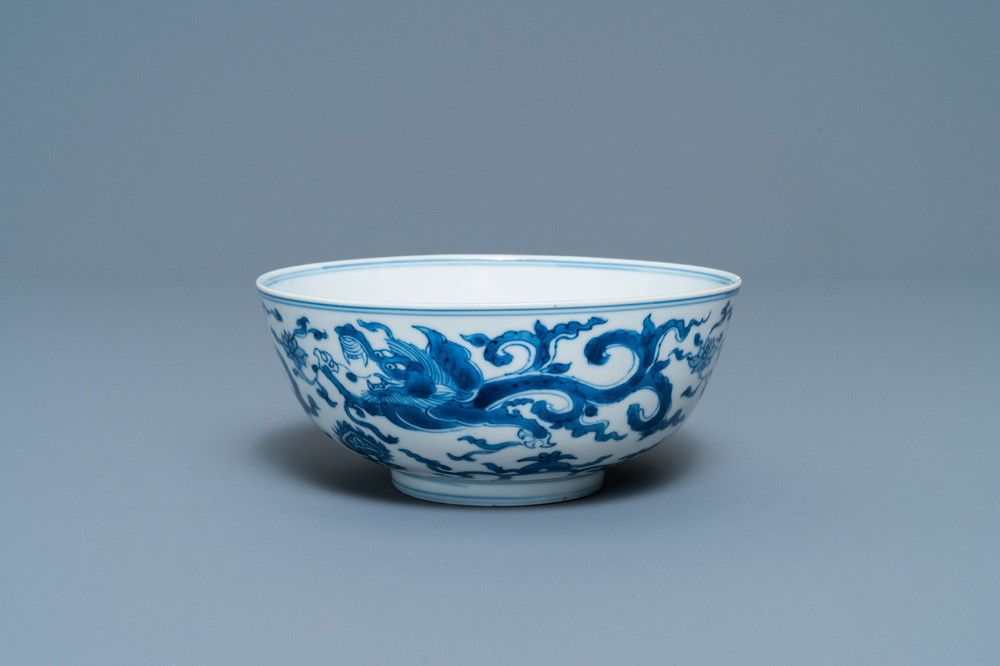 A Chinese blue and white 'dragon' bowl with a double vajra in the centre, Chenghua mark, Kangxi