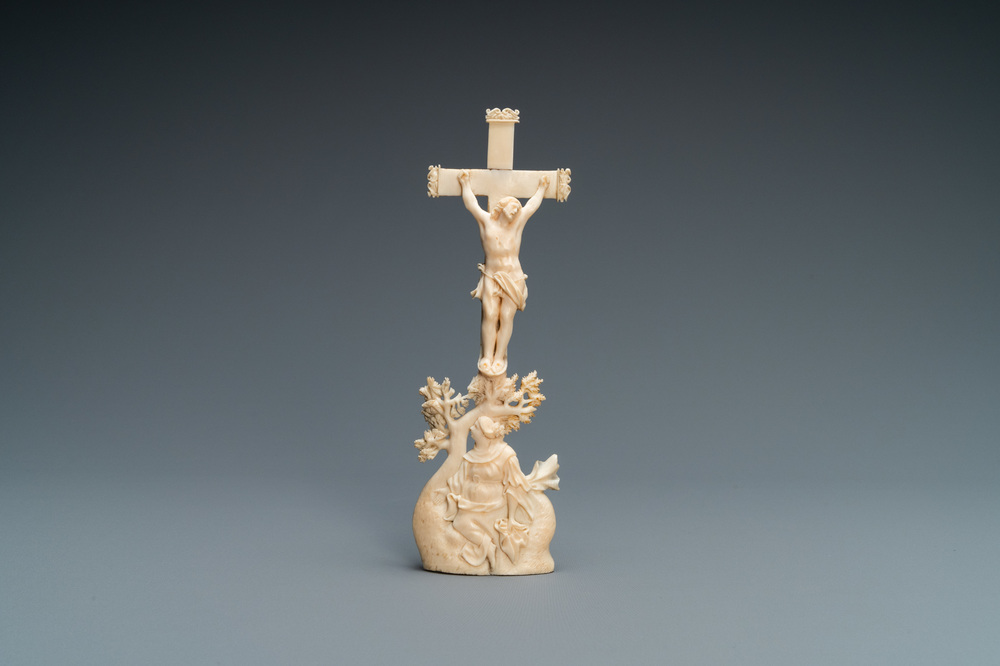 An ivory crucifixion group with Mary Magdalen beneath the cross, 18th C.