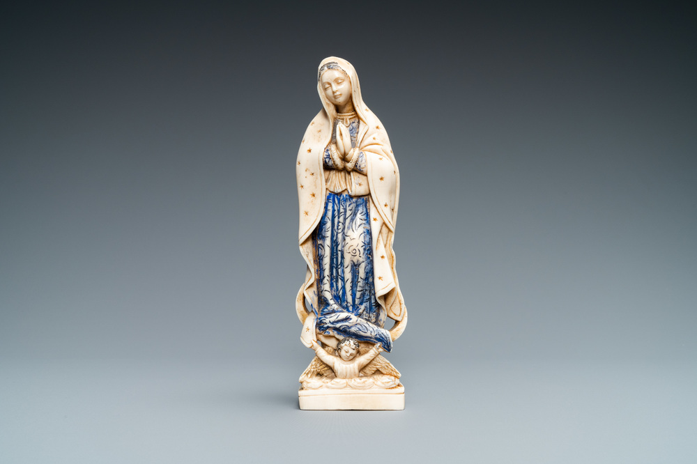 A polychromed and gilded ivory figure of a Madonna, 19th C.