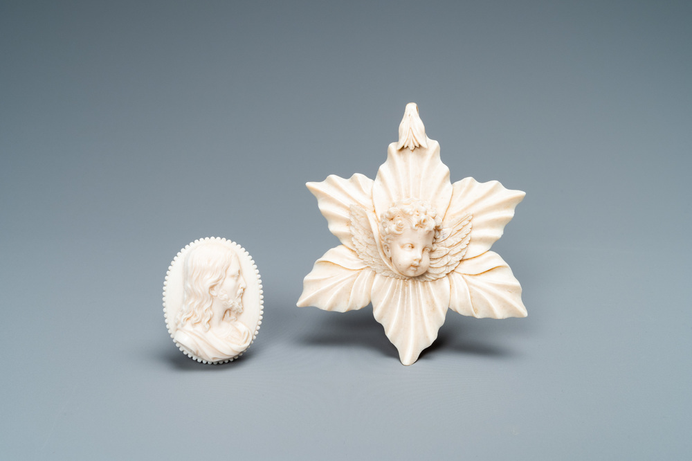 An ivory Christ medallion and a winged cherub's head on floral ground, probably France, late 18th C. and ca. 1900