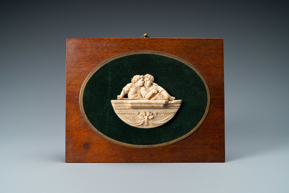 An ivory carving depicting two children, 19th C.