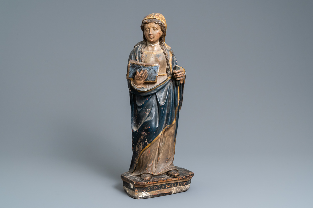 Een polychrome stenen figuur van Sint Appolonia van Alexandri&euml;, ca. 1540