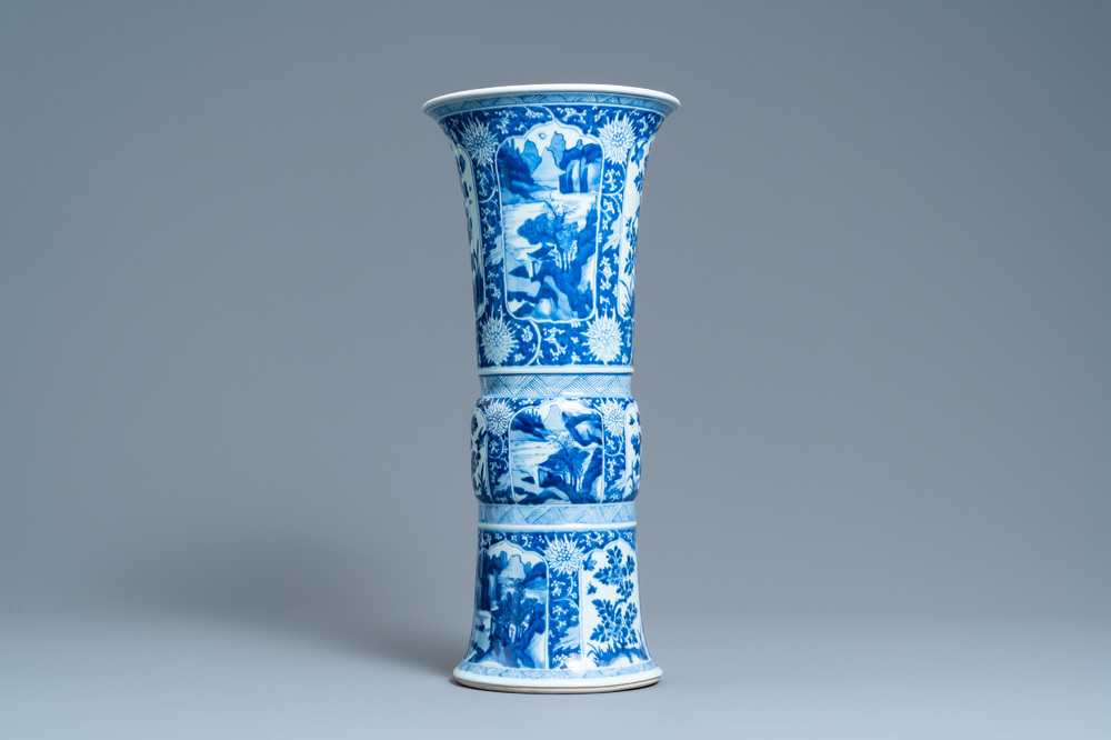 A Chinese blue and white 'gu' vase with floral and lanscape panels, Kangxi