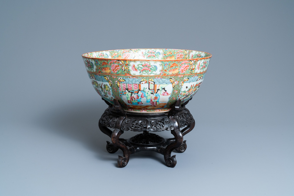 A large Chinese Canton famille rose bowl on wooden stand, 19th C.