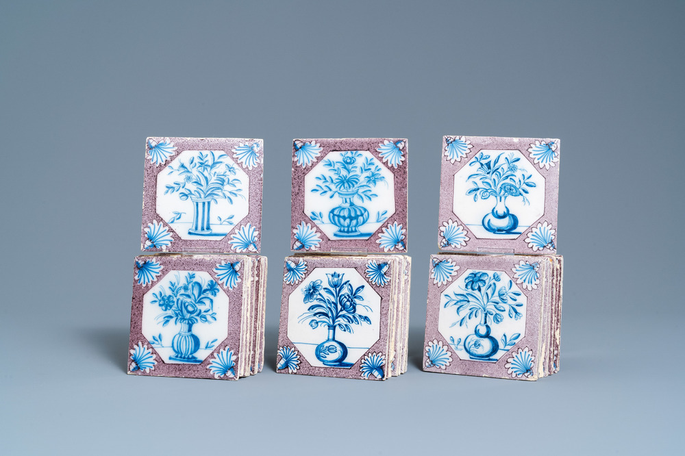 Twenty-five Dutch Delft blue, white and manganese flower vase tiles, 18th C.