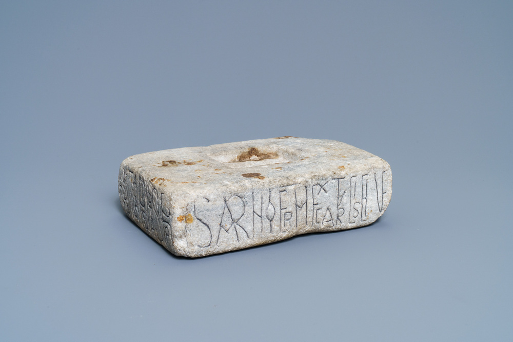 An inscribed Romanesque reliquary altar stone, France, 12th C.
