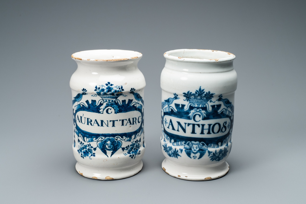 Two Dutch Delft blue and white albarello type drug jars, 18th C.