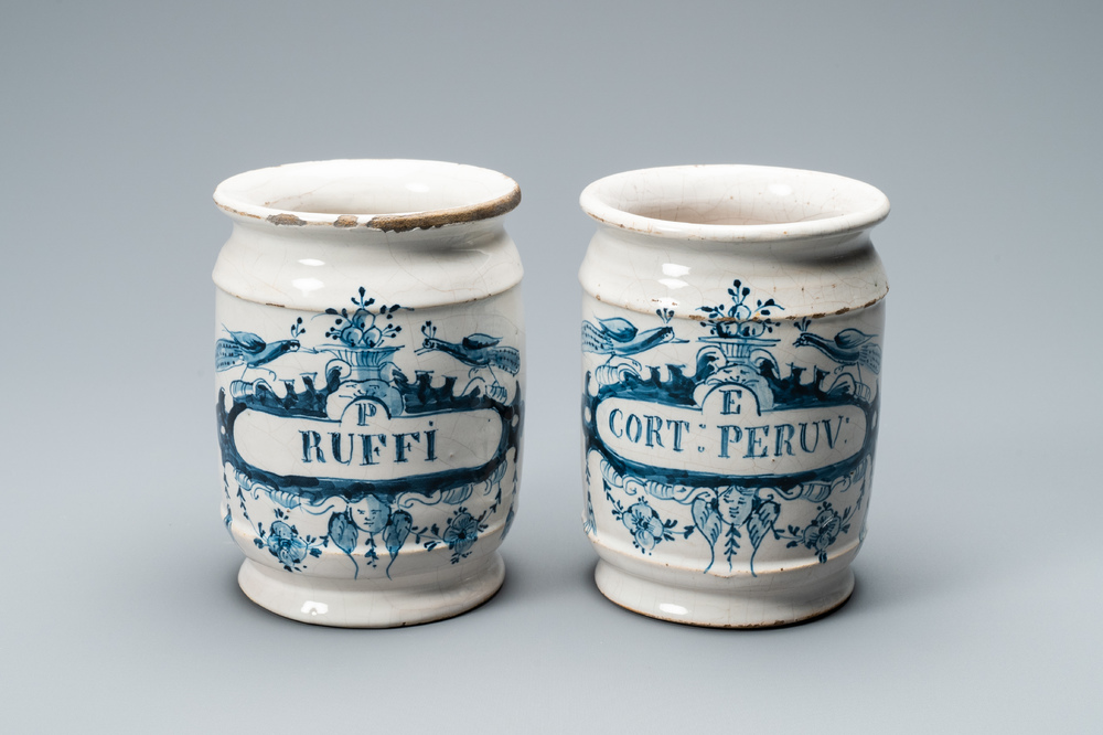 A pair of Dutch Delft blue and white albarello type drug jars, 18th C.