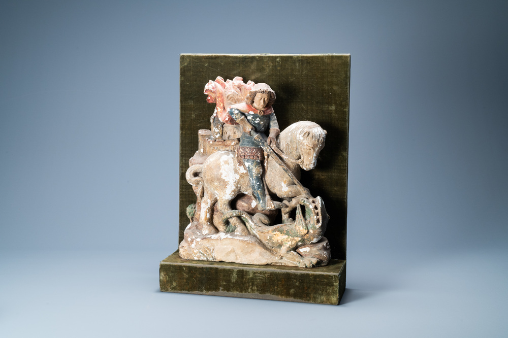 A polychromed stone group of Saint George slaying the dragon, probably Germany, 15th C.