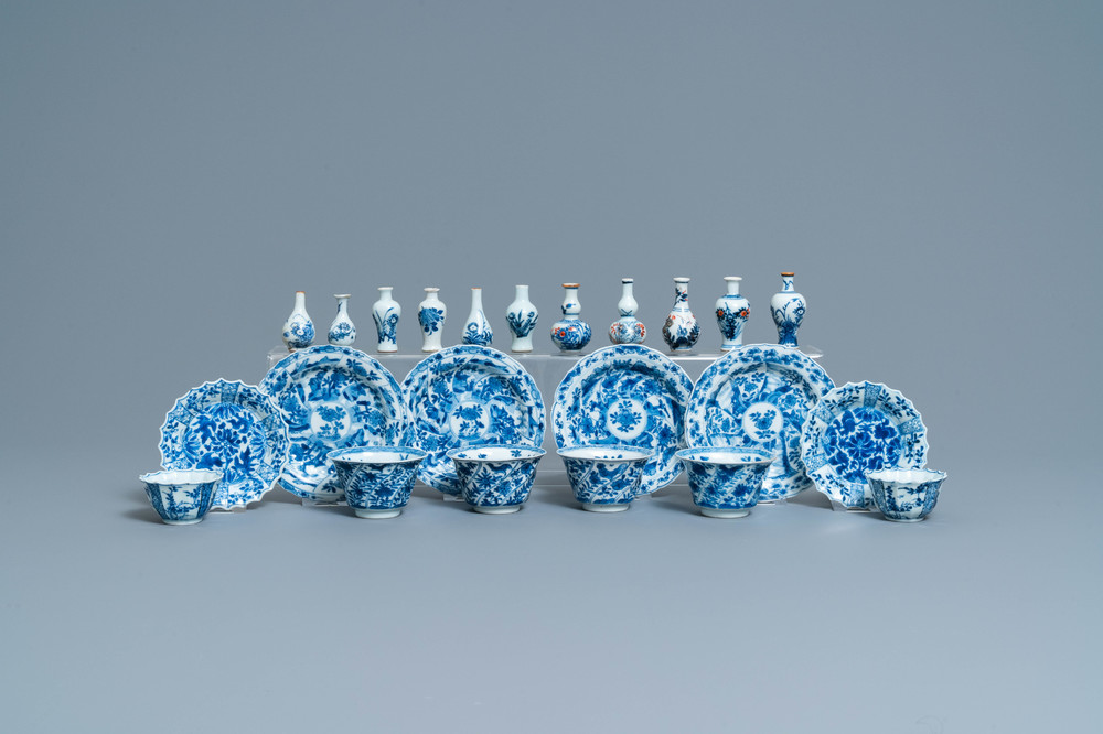 Six Chinese blue and white cups and saucers and eleven miniature vases, Kangxi