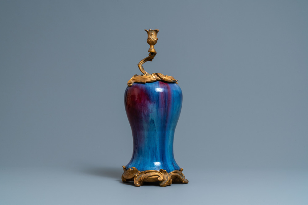 A Chinese flamb&eacute;-glazed vase with gilt bronze candelabra mount, 19th C.
