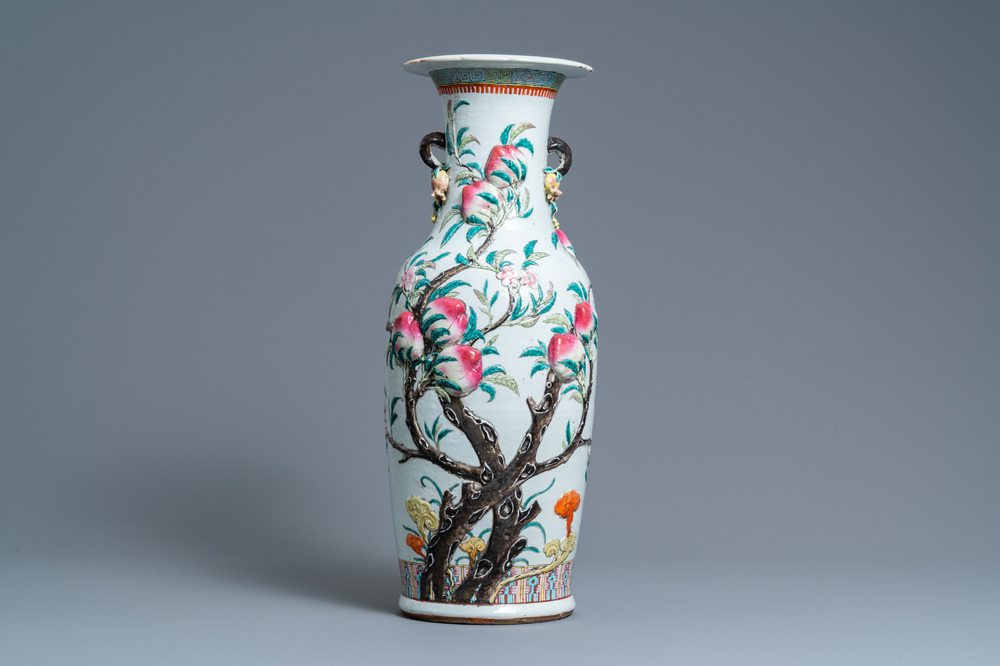 A Chinese famille rose molded 'nine peaches' vase, 19th C.
