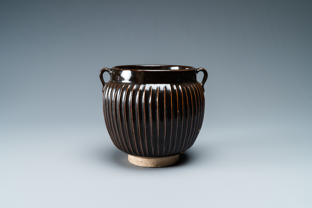 A Chinese black-glazed ribbed two-handled jar, Northern Song or Jin