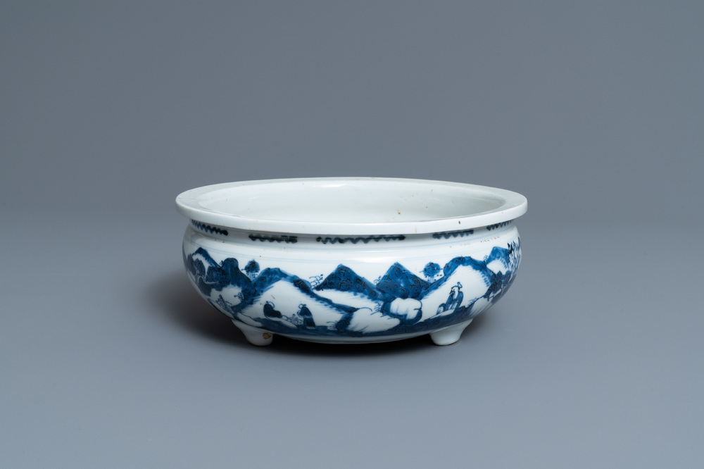 A Chinese blue and white tripod censer with figures in a mountainous landscape, Kangxi