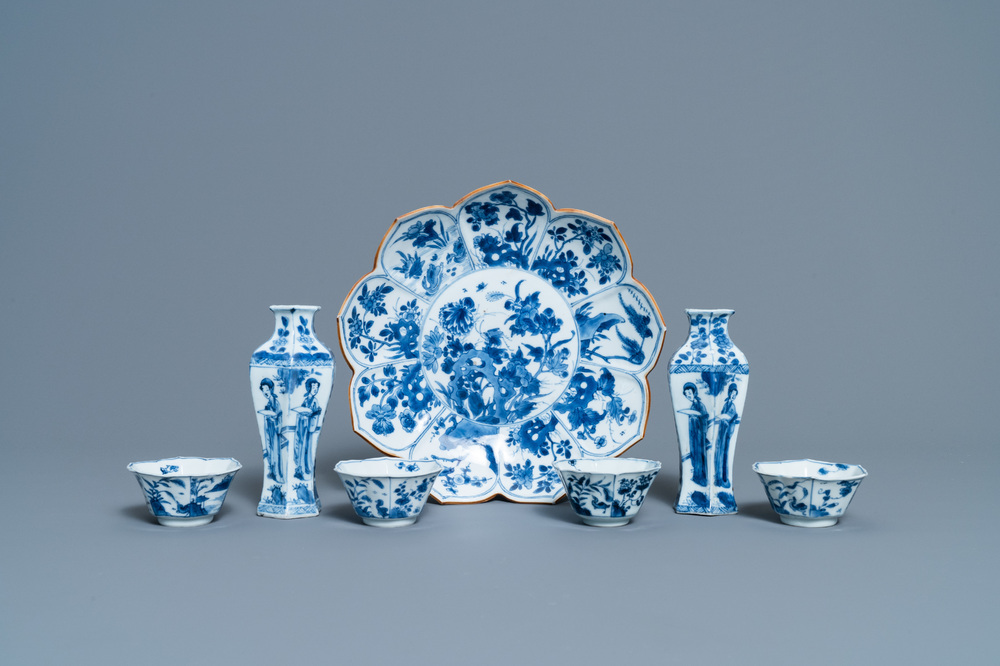 A pair of Chinese blue and white vases, a 'lotus' dish and four cups, Kangxi