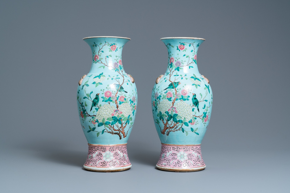 A pair of Chinese famille rose turquoise-ground vases with butterfly handles, 19th C.