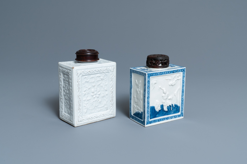 Two Chinese blanc de Chine and blue and white relief-moulded tea caddies, 19th C.