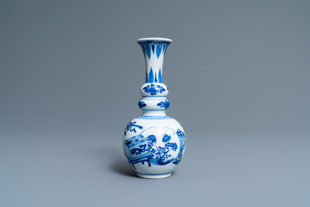 A Chinese blue and white triple gourd 'antiquities' vase, Kangxi