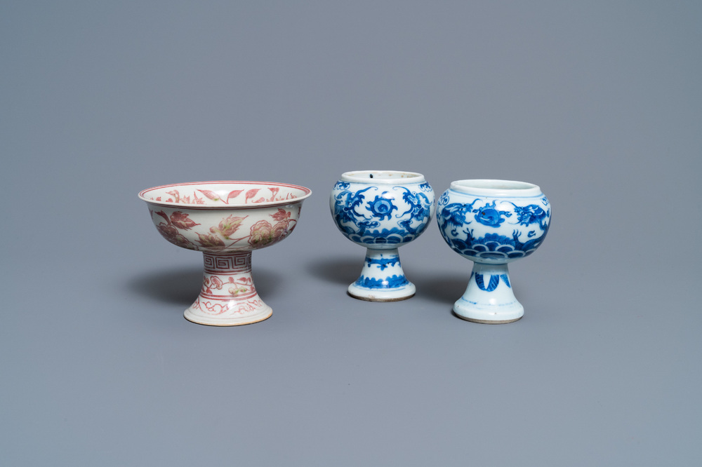 A pair of Chinese blue and white 'dragon' stem cups and one in copper-red, 19/20th C.