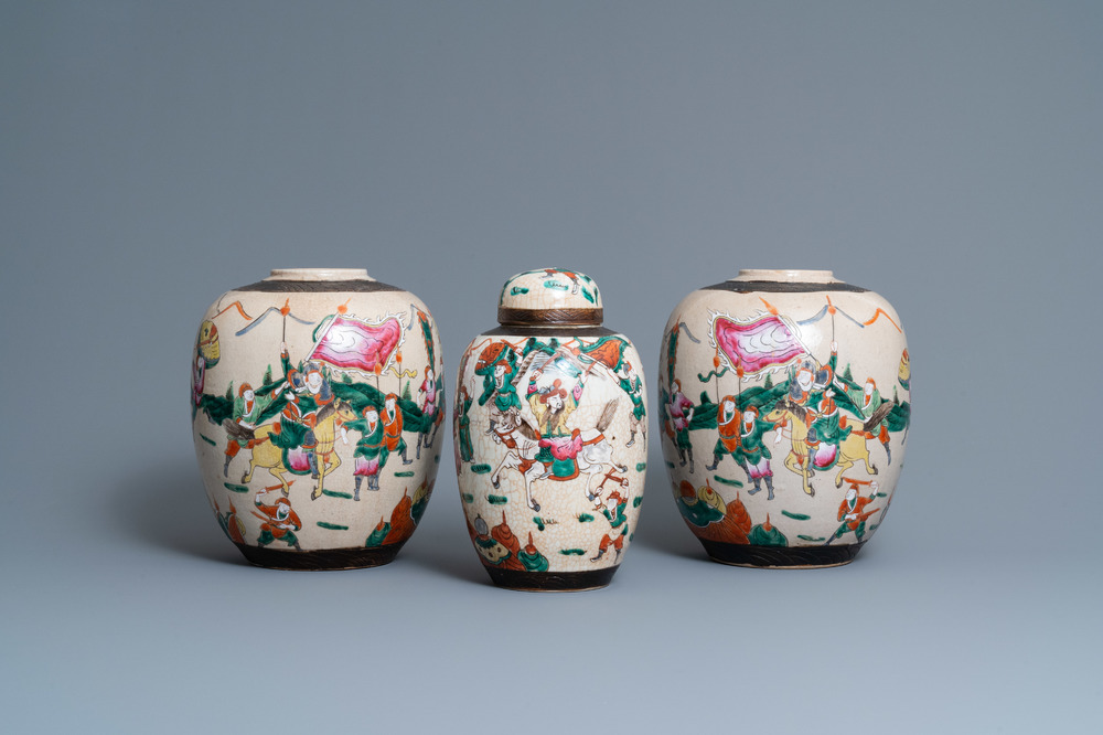 A pair of Chinese famille rose Nanking crackle-glazed jars and a jar with cover, 19th C.