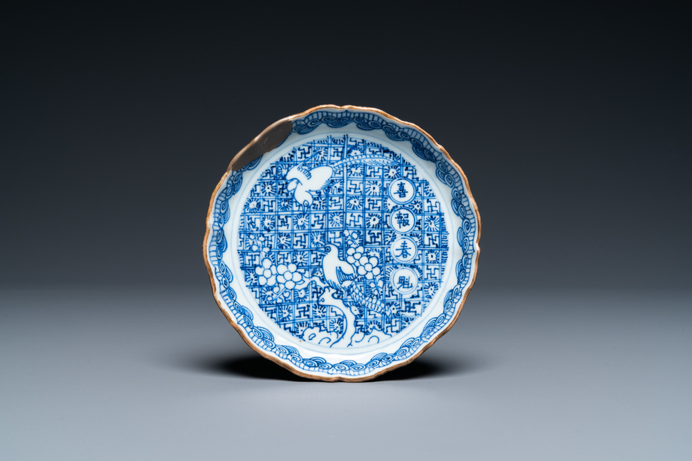 A Chinese blue and white shonzui ko-sometsuke dish with birds and calligraphy, Chongzhen