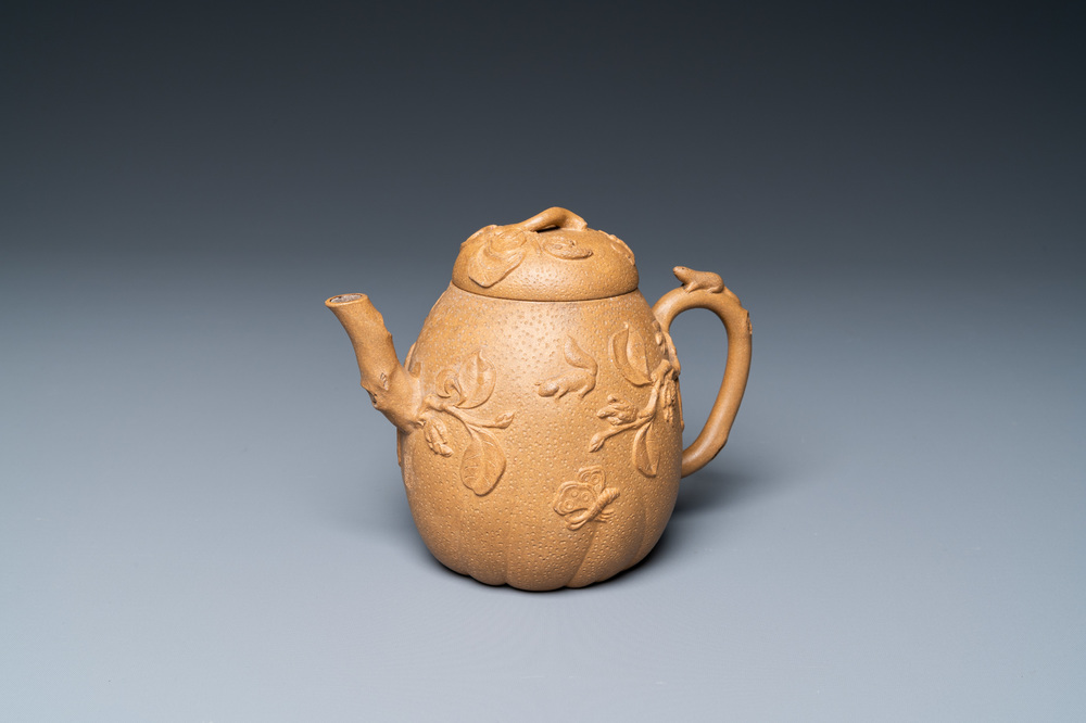 A Chinese Yixing stoneware teapot with squirrels and butterflies, seal mark, 18th C.
