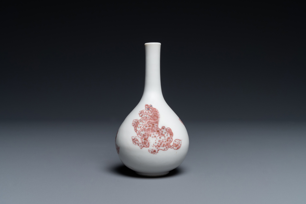 A small Chinese copper-red bottle vase with Buddhist lions, Kangxi