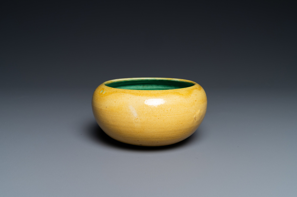 A Chinese monochrome yellow alms bowl with green interior, Kangxi